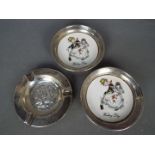 Three white metal dishes