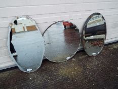 Three wall mirrors, largest approximately 56 cm (d).