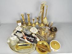 A collection of metalware to include plated, brass and similar.