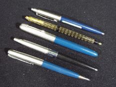 Pens - A collection of writing instruments to include a Sheaffer ball point, Parker fountain pen,