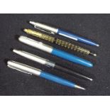 Pens - A collection of writing instruments to include a Sheaffer ball point, Parker fountain pen,