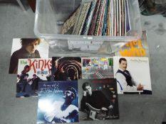 A collection of 12" vinyl records to include Bob Dylan, The Kinks, The Rolling Stones, 10cc,