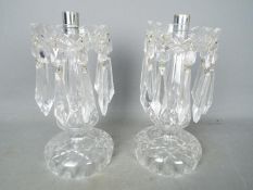 A pair of glass centerpieces.