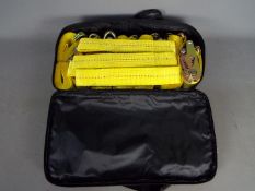 A vehicle recovery strap set in carry case