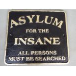 A cast sign marked Asylum