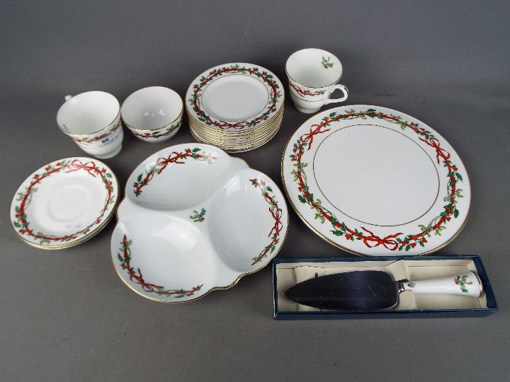 Royal Worcester - A quantity of Royal Worcester ceramics in the Holly Ribbons pattern.