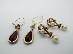 Two pairs of yellow metal drop earrings (unmarked,