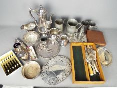 A large quantity of plated ware including salvers, cruet set, flatware,