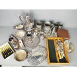 A large quantity of plated ware including salvers, cruet set, flatware,