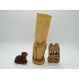 A Japanese carved wood netsuke in the form of a goat, signed,