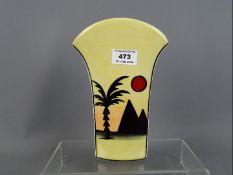 Lorna Bailey - a vase with flared arch top decorated in the Pyramids pattern, signed to the base,