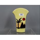 Lorna Bailey - a vase with flared arch top decorated in the Pyramids pattern, signed to the base,