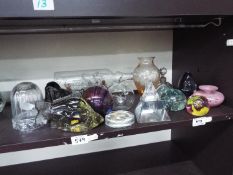 A mixed lot of glassware comprising paperweights, vases, inkwell, scent bottle and similar.