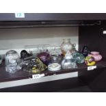 A mixed lot of glassware comprising paperweights, vases, inkwell, scent bottle and similar.