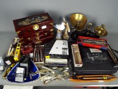 General - A box containing mixed items including a kitchen scale with weights,