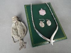 A necklace and earrings, stamped 925,