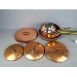 A set of four good quality copper cooking pans.