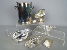 A quantity of plated ware to include a champagne cooler/sleeve,