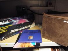 A Yamaha keyboard and a quantity of vinyl records (2)