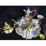 A collection of plated ware to include a Garrard and Co tea set comprising tea pot, coffee pot,