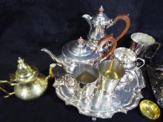 A collection of plated ware to include a Garrard and Co tea set comprising tea pot, coffee pot,