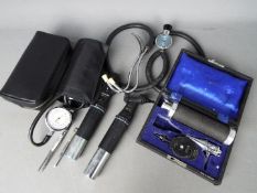 A quantity of vintage medical equipment to include sphygmomanometer, ophthalmoscope,