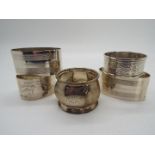 Silver - three Silver hallmarked napkin rings with various designs and dates,