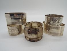 Silver - three Silver hallmarked napkin rings with various designs and dates,