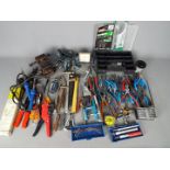 A collection of tools to include some watchmakers tools.