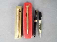 Two Wahl Eversharp filled gold propelling pencils,