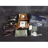 Photography - A collection of cameras to include a Braun Paxina, Hanimex, Panasonic,