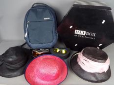 A hat box containing four lady's hats including a Marzi Firenze,