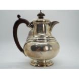 A George V hallmarked silver coffee pot, Birmingham assay 1923,