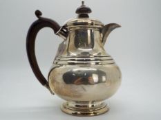 A George V hallmarked silver coffee pot, Birmingham assay 1923,