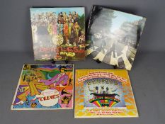 The Beatles - Four 12" Beatles vinyl records comprising Abbey Road PCS7088 (French issue),