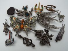 Brooches - eleven stone set brooches with various designs