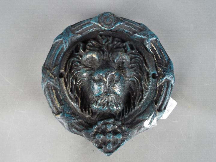 Door Furniture - a large cast door knocker in the form of a lions head