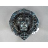 Door Furniture - a large cast door knocker in the form of a lions head
