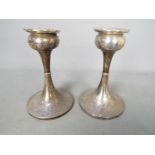 A pair if Edward VII hallmarked silver candlesticks, Birmingham assay 1902, sponsors mark for S.