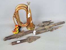 A copper and brass bugle with a tribal carving (A/F).