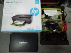 A Toshiba laptop, a boxed HP OfficeJet Pro 6230 colour printer, phones, mobile phone and similar.