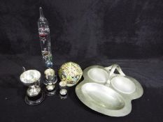 Two hallmarked silver trophies and one unmarked white metal example,
