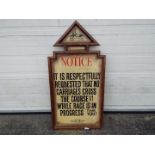 A large wooden sign purportedly used at Aintree racecourse reading 'Notice It Is Respectfully