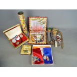 A mixed lot to include a vintage Smarties tin, royal commemorative, medals,