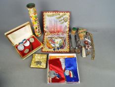 A mixed lot to include a vintage Smarties tin, royal commemorative, medals,