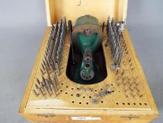 A vintage watchmakers staking set.