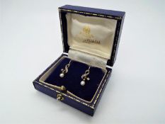 9ct Gold - a pair of 9ct gold stone set and pearl drop earrings, stamped,