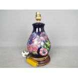 Moorcroft - A Moorcroft Pottery table lamp in the 'Anemone' pattern,