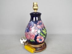 Moorcroft - A Moorcroft Pottery table lamp in the 'Anemone' pattern,
