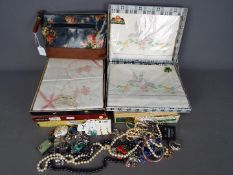 Six boxed sets of vintage Irish linen, all appear unused, and a small quantity of costume jewellery.